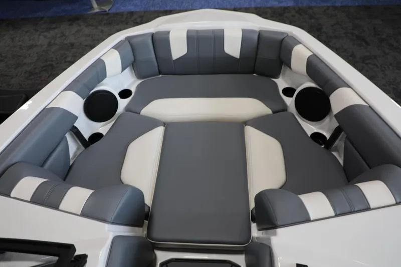 Slide: The Image of 2024 Malibu 21 LX-R boat interior with gray and white cushioned seating. - 5