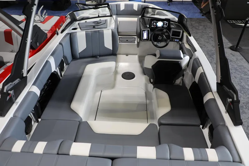 Slide: The Image of 2024 Malibu 21 LX-R boat interior with modern seating and dashboard design. - 7
