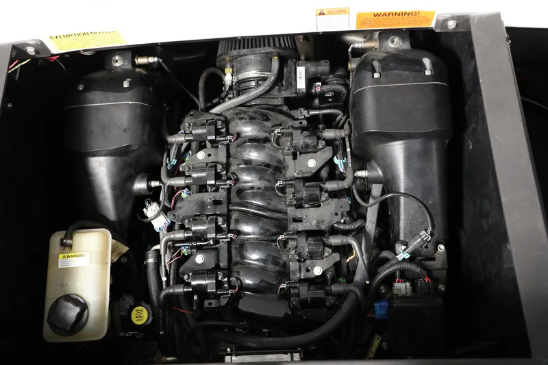 Slide: The Image of 2014 Malibu 24MXZ engine compartment with visible components and wiring. - 5