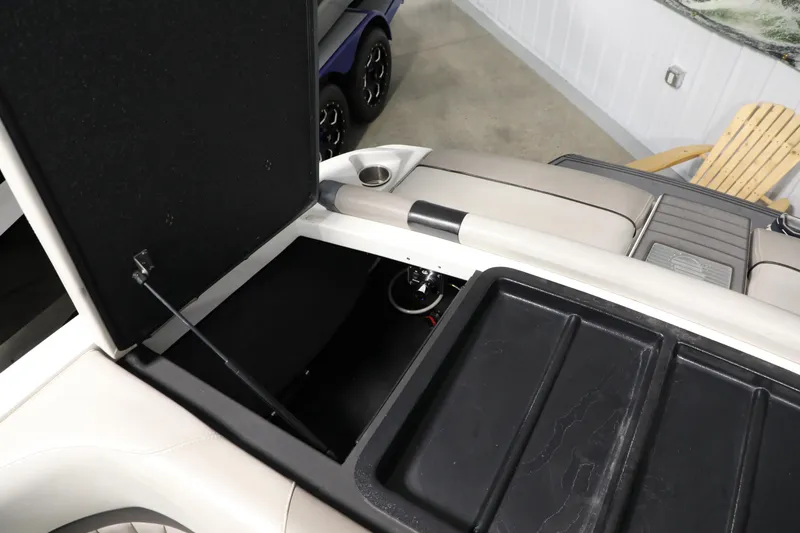Slide: The Image of Open storage compartment in 2014 Malibu 24MXZ boat interior. - 6