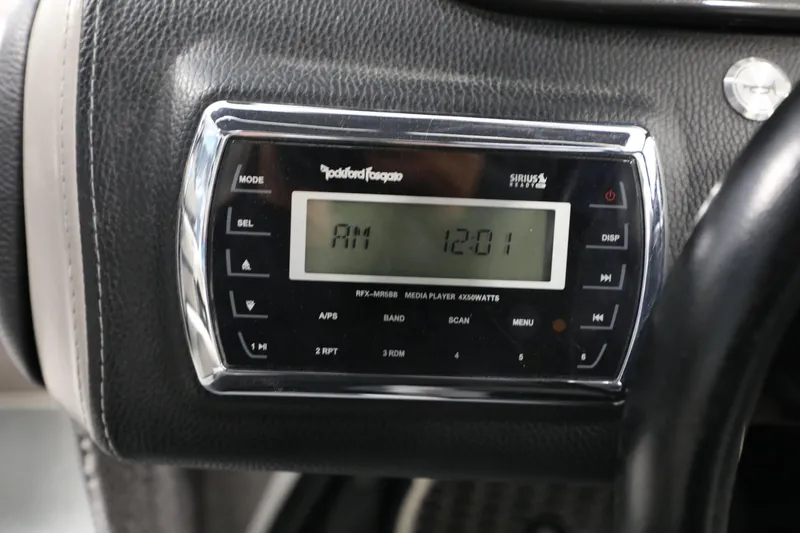 Slide: The Image of 2014 Malibu 24MXZ dashboard with Rockford Fosgate media player display. - 8