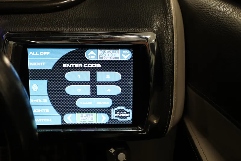 Slide: The Image of Touchscreen control panel in 2014 Malibu 24MXZ boat dashboard. - 9