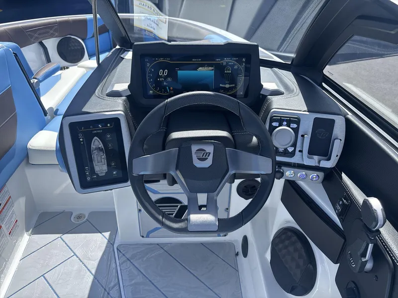 Slide: The Image of 2024 Malibu 25LSV boat dashboard with advanced controls and digital displays. - 11