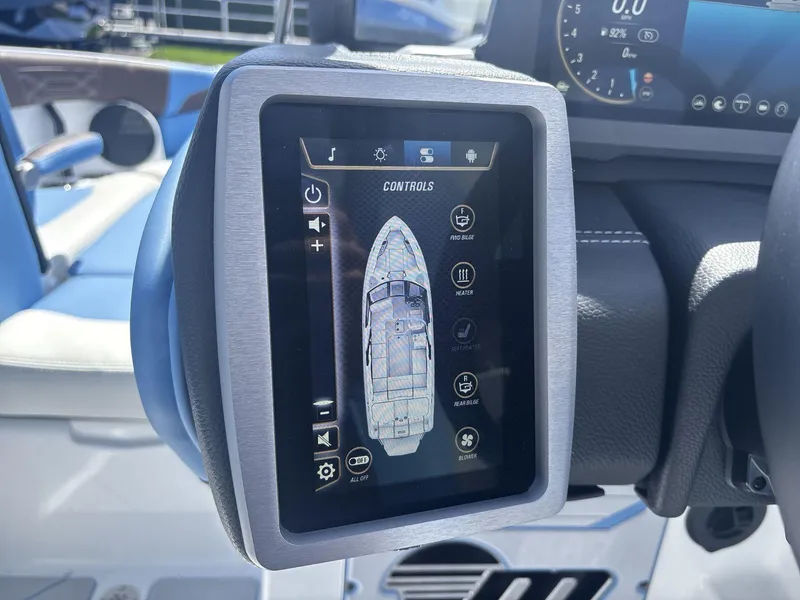 Slide: The Image of Touchscreen control panel in 2024 Malibu 25LSV boat cockpit, displaying various settings. - 12