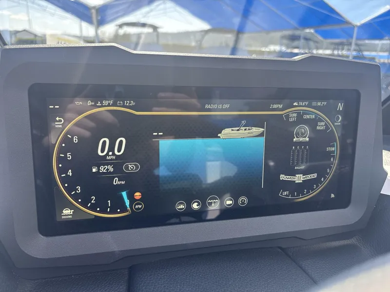 Slide: The Image of 2024 Malibu 25LSV dashboard display showing speed, fuel, and surf settings. - 13