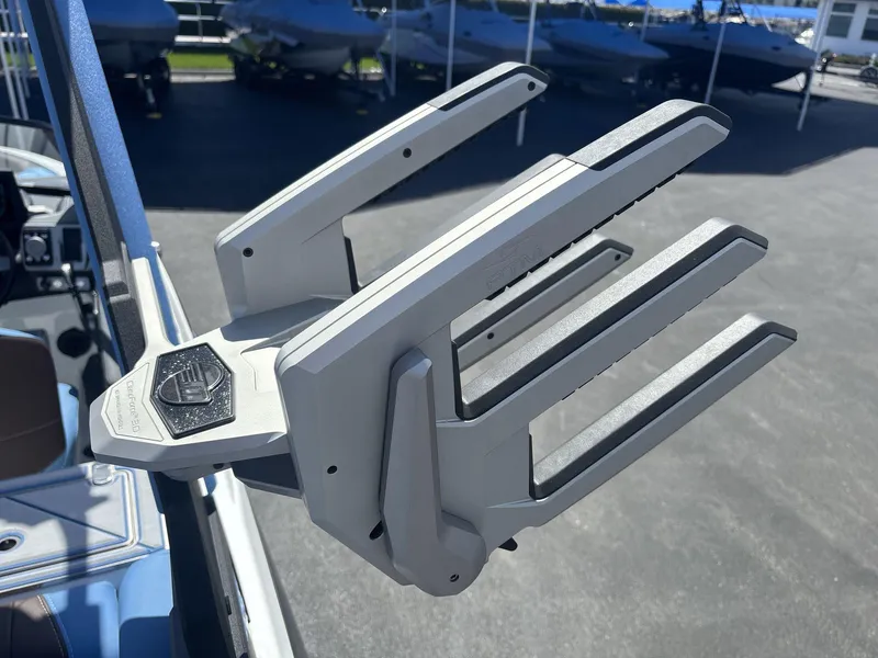 Slide: The Image of 2024 Malibu 25LSV boat with a sleek, modern wakeboard rack design. - 17