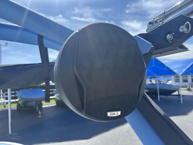 Slide: The Image of Close-up of a 2024 Malibu 25LSV boat speaker under a sunny sky. - 18