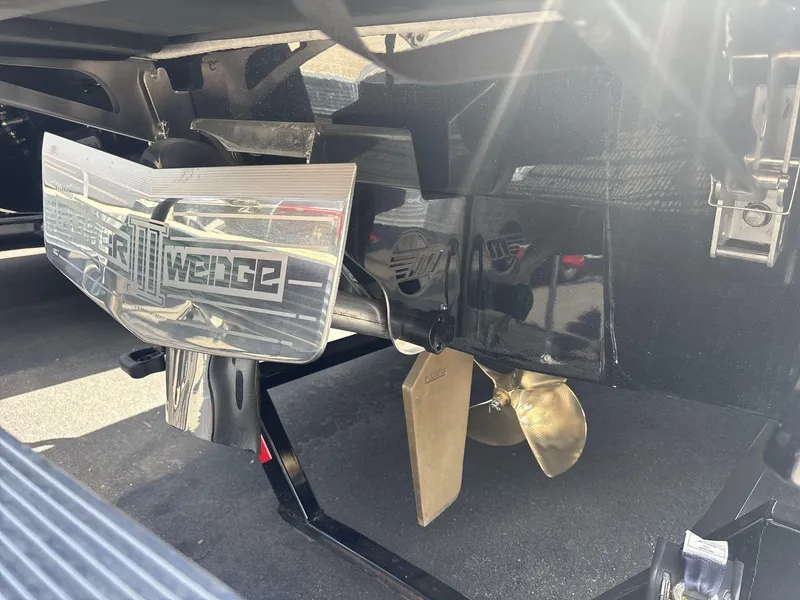 Slide: The Image of 2024 Malibu 25LSV boat with Power Wedge III and propeller detail. - 5