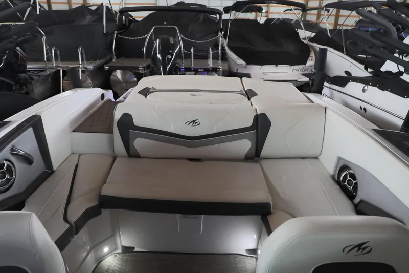 Slide: The Image of 2018 Monterey 238 SS Surf boat interior with cushioned seating and modern design. - 11