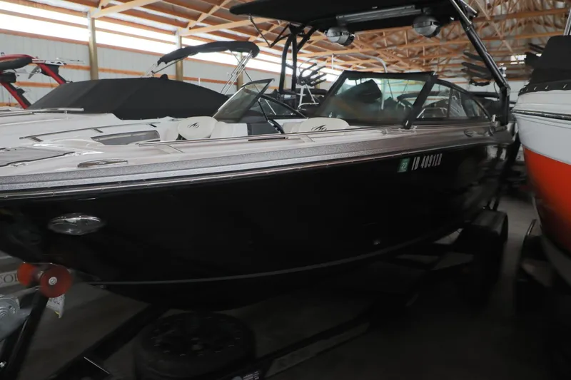 Slide: The Image of 2018 Monterey 238 SS Surf boat in storage, black exterior, indoor facility. - 4