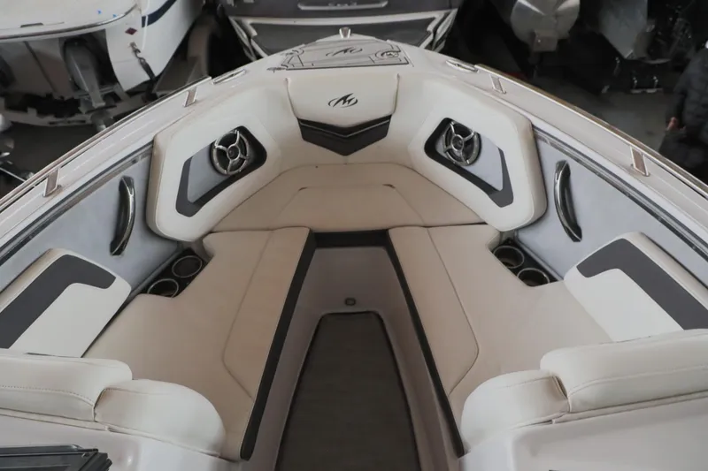 Slide: The Image of 2018 Monterey 238 SS Surf boat interior with beige seating and cup holders. - 6