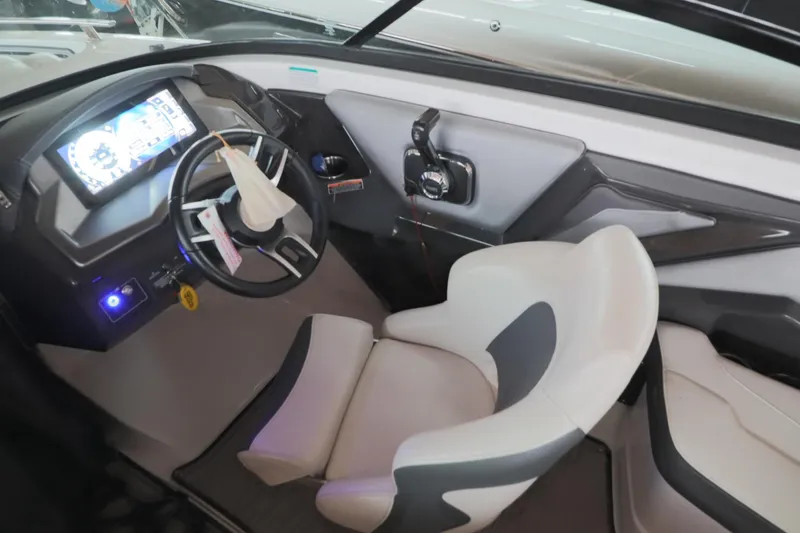 Slide: The Image of 2018 Monterey 238 SS Surf boat interior with steering wheel and dashboard display. - 8