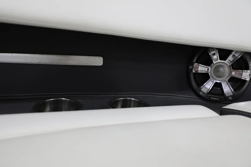 Slide: The Image of Close-up of 2017 Regal 2800 Bowrider interior with speaker and cup holders. - 12