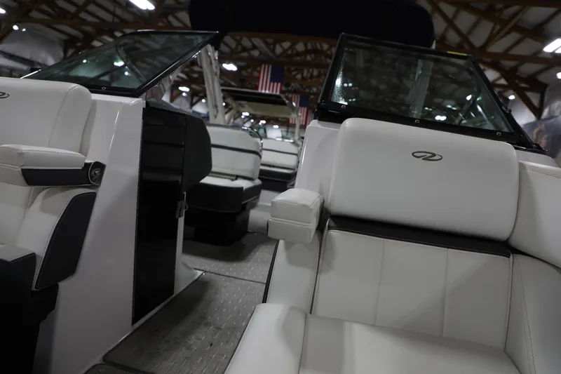 Slide: The Image of Interior of a 2017 Regal 2800 Bowrider boat with white leather seats. - 13