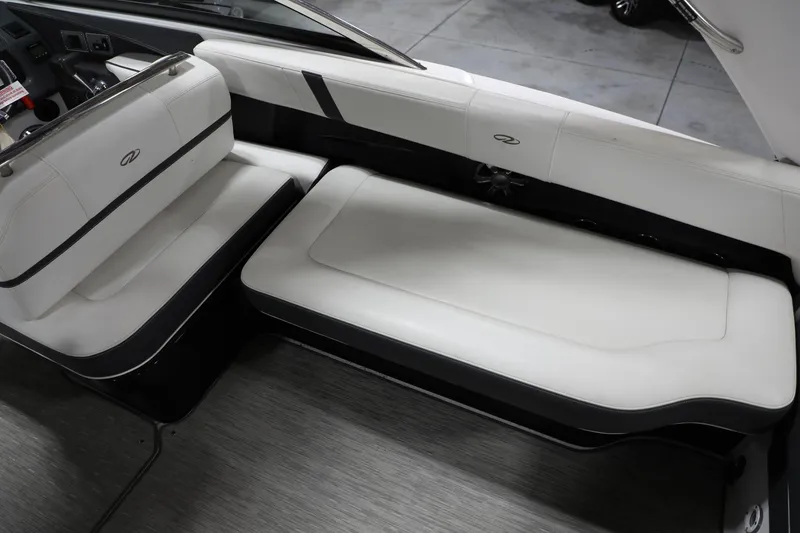 Slide: The Image of Interior seating of a 2017 Regal 2800 Bowrider boat with white and black upholstery. - 15