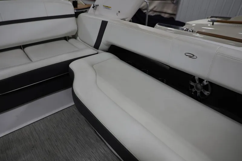 Slide: The Image of Interior seating of a 2017 Regal 2800 Bowrider boat with white and black upholstery. - 4