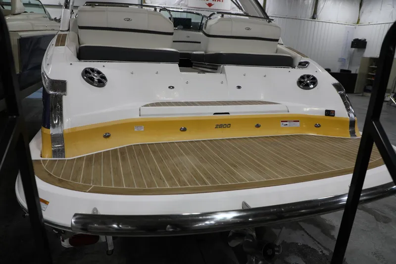 Slide: The Image of 2017 Regal 2800 Bowrider boat with teak swim platform and rear seating. - 6