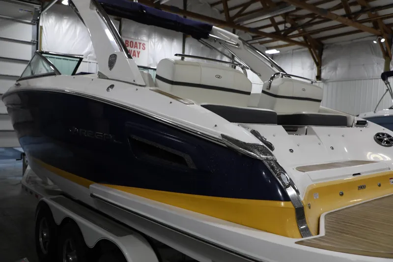 Slide: The Image of 2017 Regal 2800 Bowrider boat in indoor storage, rear view. - 7