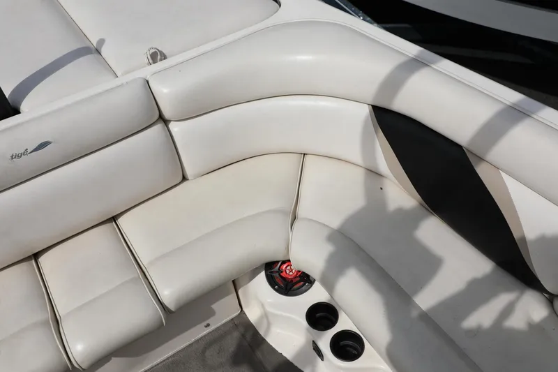 Slide: The Image of Tigé 2100V 2000 boat interior with white seating and cup holders. - 13
