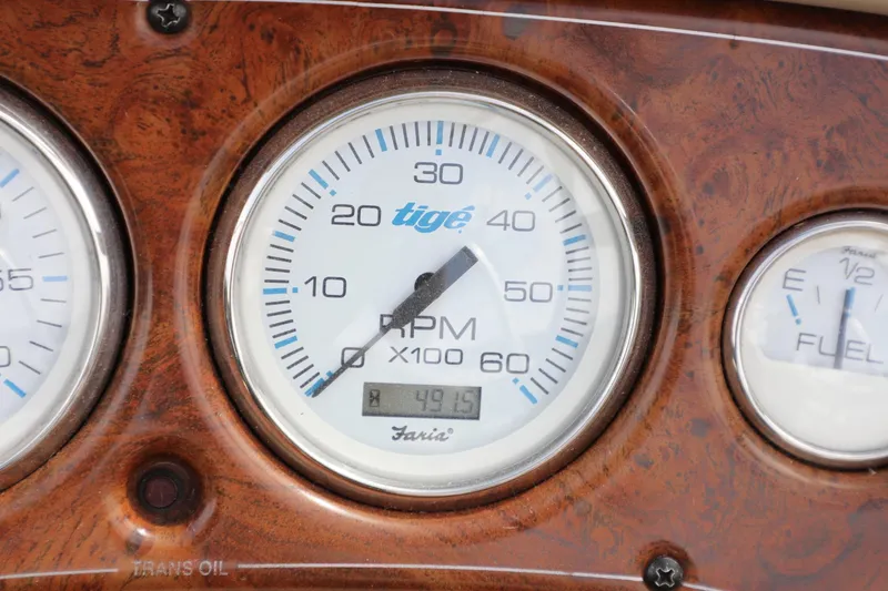 Slide: The Image of Close-up of Tigé 2100V 2000 boat dashboard with RPM gauge. - 16