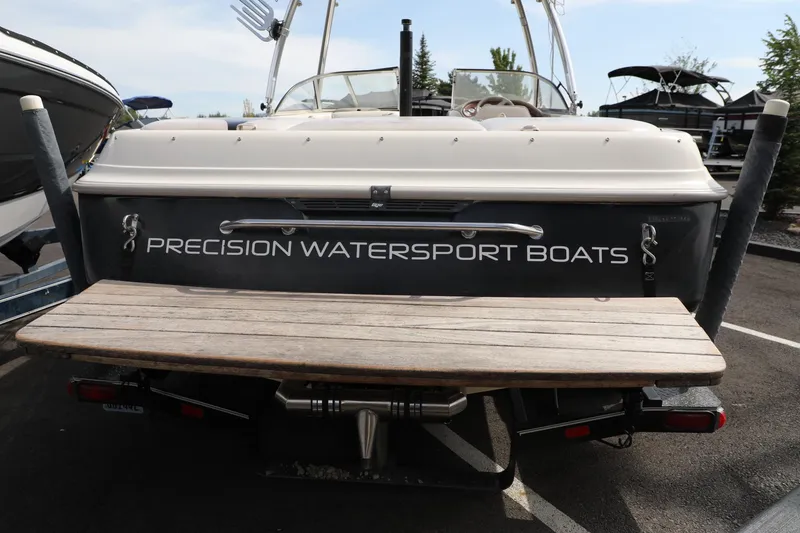 Slide: The Image of 2000 Tigé 2100V boat, rear view, with "Precision Watersport Boats" branding. - 5