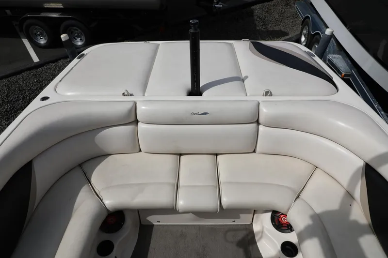 Slide: The Image of 2000 Tigé 2100V boat interior with white cushioned seating. - 7