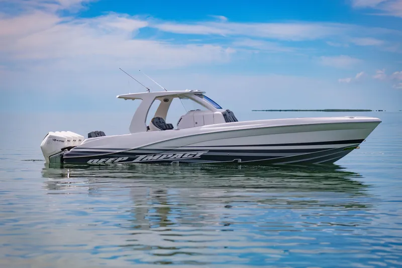 Slide: The Image of 2024 Deep Impact 369 boat on calm water under a blue sky. - 12