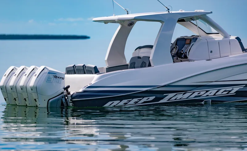 Slide: The Image of 2024 Deep Impact 369 boat with quad outboard engines on calm water. - 15
