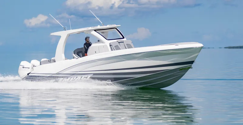 Slide: The Image of 2024 Deep Impact 369 boat cruising on calm water under a clear sky. - 16