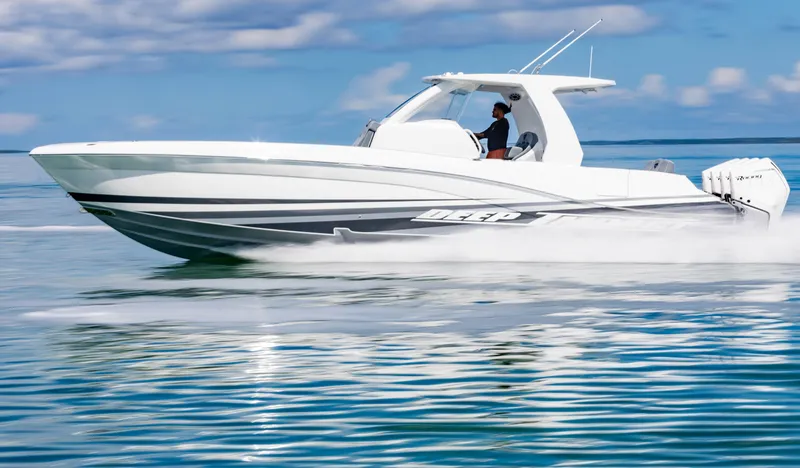 Slide: The Image of 2024 Deep Impact 369 Deep Impact boat cruising on water. - 23