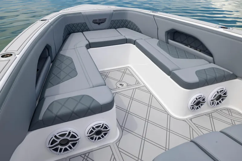 Slide: The Image of 2024 Deep Impact 369 boat interior with gray seating and built-in speakers. - 24