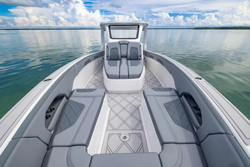 Slide: The Image of 2024 Deep Impact 369 boat with luxurious seating on calm waters. - 25