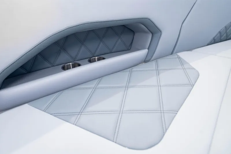 Slide: The Image of 2024 Deep Impact 369 Deep Impact boat interior with diamond-stitched upholstery and cup holders. - 30