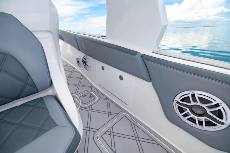 Slide: The Image of 2024 Deep Impact 369 boat interior with gray seating and marine speakers. - 38