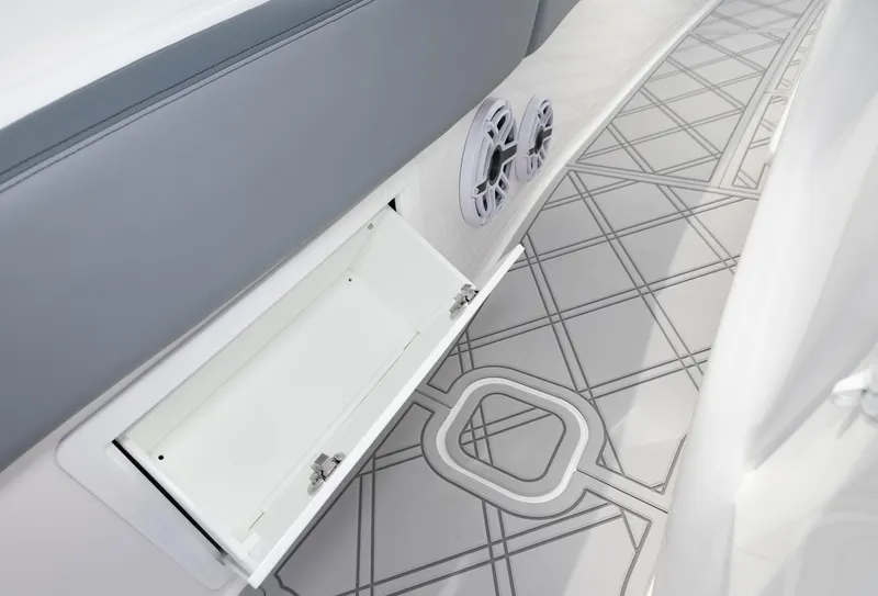 Slide: The Image of 2024 Deep Impact 369 boat interior with open storage compartment and patterned flooring. - 39