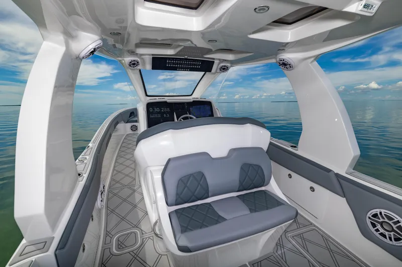 Slide: The Image of 2024 Deep Impact 369 boat interior with modern seating and ocean view. - 43
