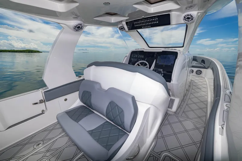 Slide: The Image of 2024 Deep Impact 369 Deep Impact boat interior with modern seating and navigation system. - 44