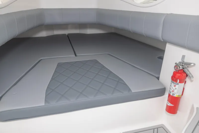 Slide: The Image of 2024 Deep Impact 369 Deep Impact cabin interior with grey cushioned seating and fire extinguisher. - 46