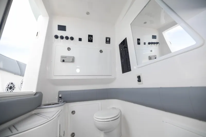 Slide: The Image of 2024 Deep Impact 369 Deep Impact boat interior bathroom with modern fixtures and control panel. - 48