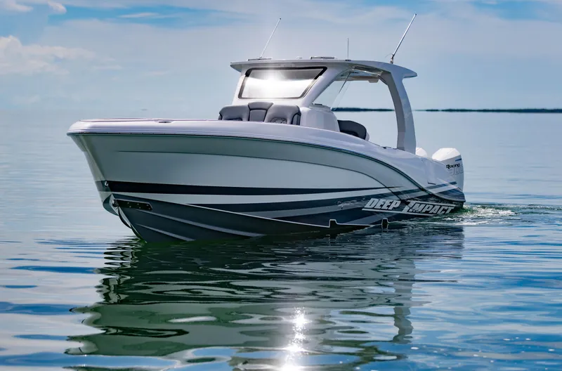 Slide: The Image of 2024 Deep Impact 369 boat cruising on calm waters under a clear sky. - 5