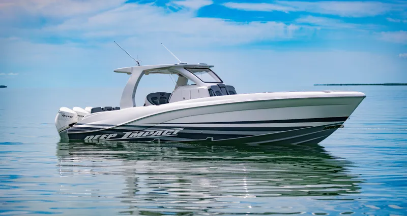 Slide: The Image of 2024 Deep Impact 369 boat on calm water under a blue sky. - 9