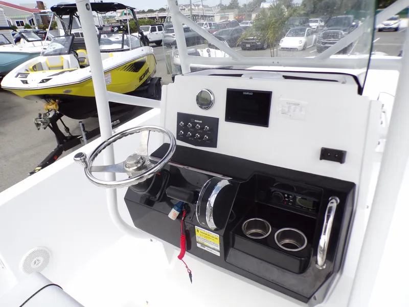 Slide: The Image of 2023 Wellcraft 202 Fisherman boat console with steering wheel and control panel. - 10
