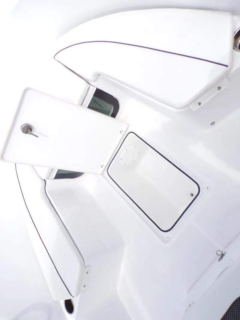 Slide: The Image of 2023 Wellcraft 202 Fisherman boat interior storage compartments. - 15