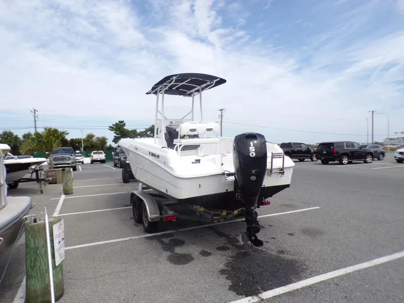 Slide: The Image of 2023 Wellcraft 202 Fisherman boat on trailer in parking lot. - 5