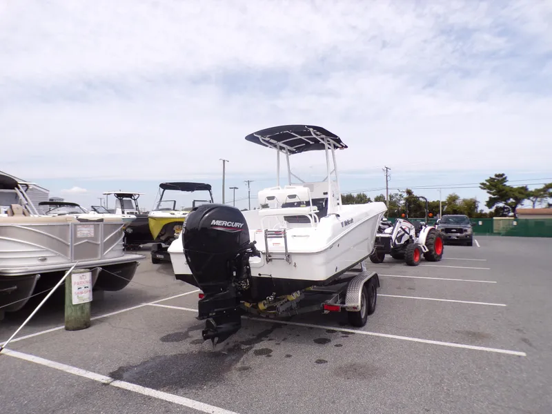 Slide: The Image of 2023 Wellcraft 202 Fisherman boat on trailer in parking lot. - 6