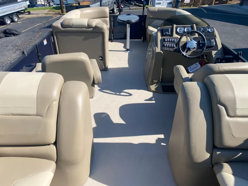 Slide: The Image of Interior of a 2022 SunChaser Geneva 22 LR DH pontoon boat with beige seating. - 17
