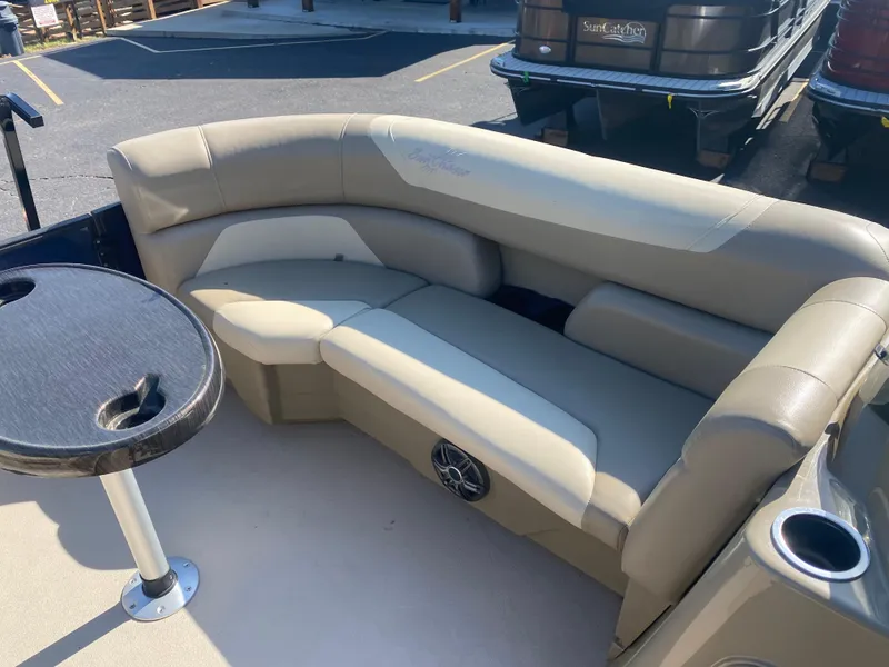 Slide: The Image of 2022 SunChaser Geneva 22 LR DH pontoon boat with beige seating and table. - 7