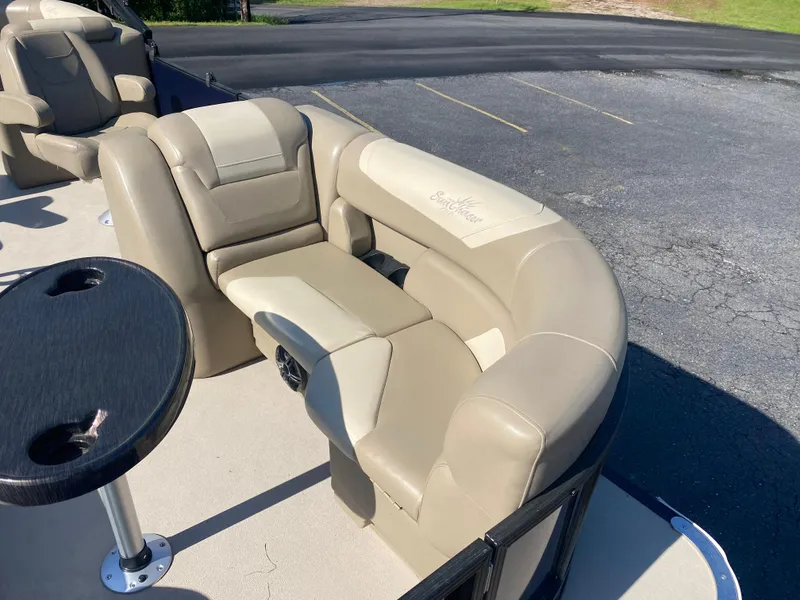 Slide: The Image of 2022 SunChaser Geneva 22 LR DH boat with beige seating and black table. - 8