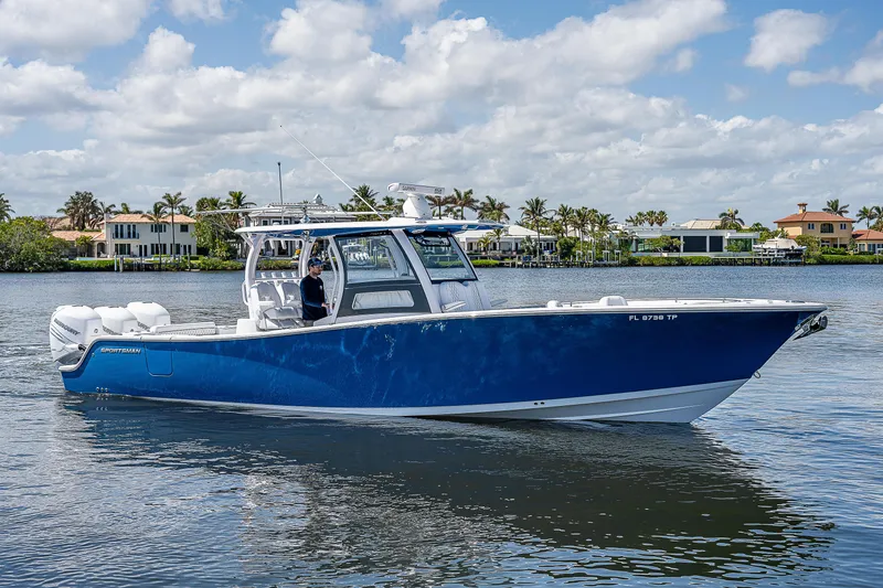 Slide: The Image of 2023 Sportsman Open 352 Center Console boat on calm water. - 1