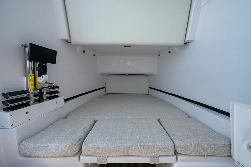 Slide: The Image of 2023 Sportsman Open 352 Center Console cabin interior with cushioned seating. - 14
